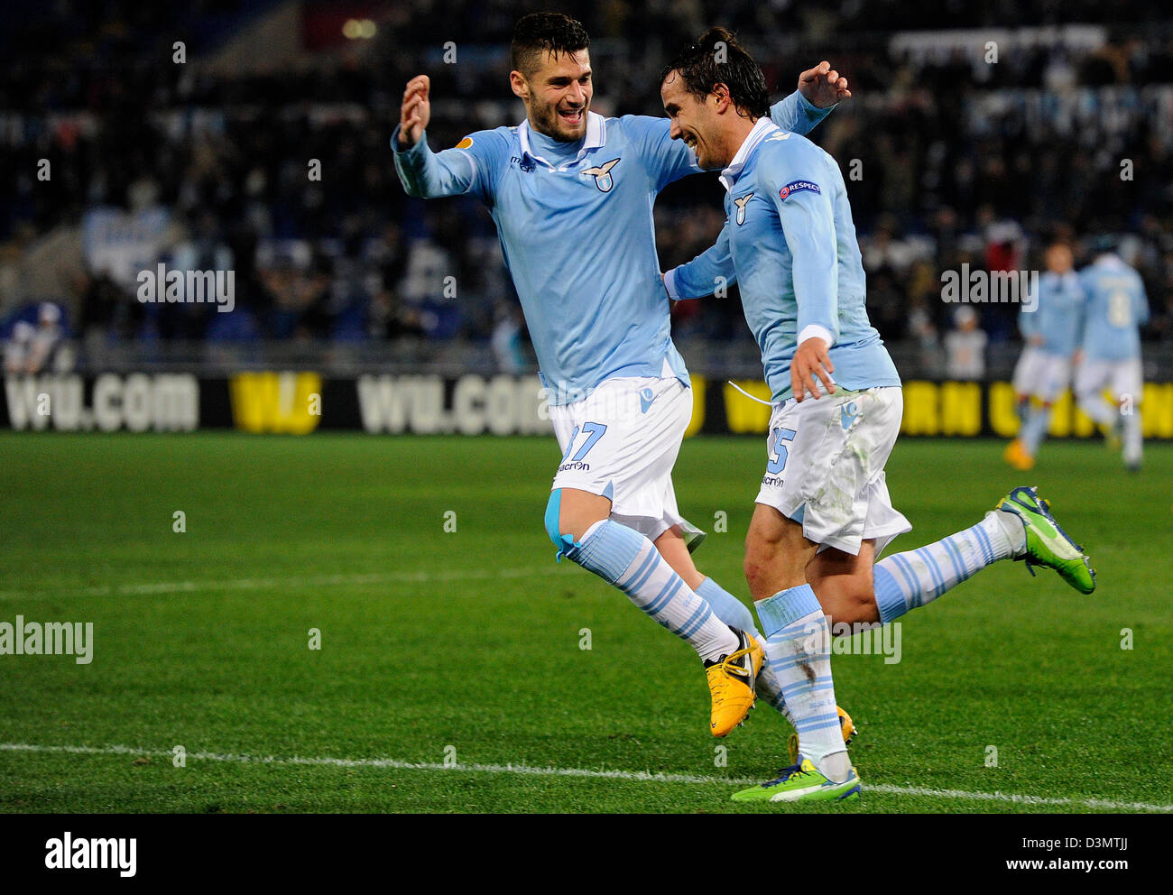 Rome, Italy. 21st February 2013. Lazio's Alvaro Gonzalez (R) celebrates with Lorik Cana after scoring the 2-0 during the UEFA Europa League Round of 32 second leg soccer match between Lazio Rome and Borussia Moenchengladbach at the Olympic Stadium in Rome, Italy, 21 February 2013. Photo: Marius Becker/dpa /Alamy Live News+++(c) dpa /Alamy Live News- Bildfunk+++ Stock Photo