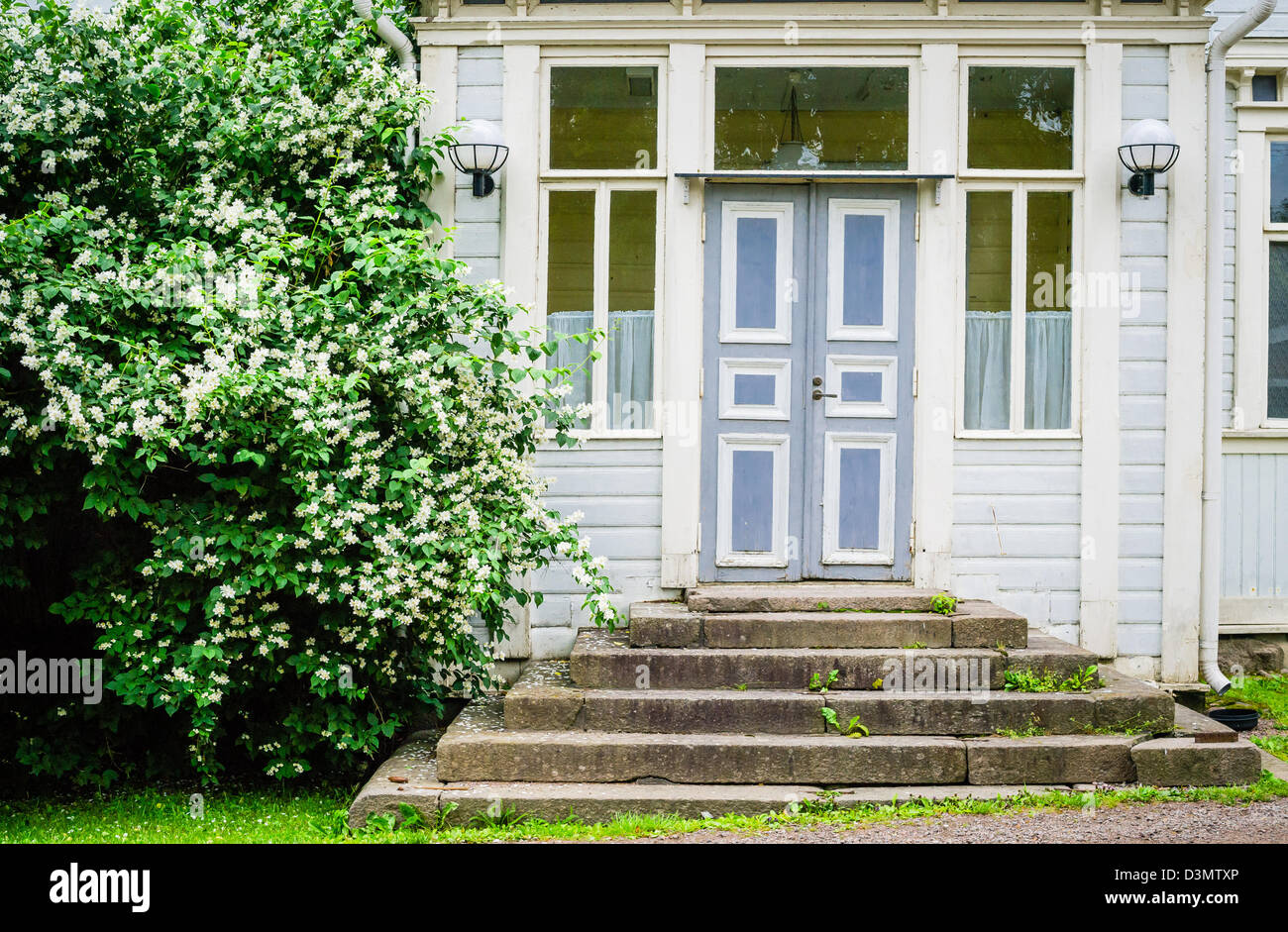 Old idyllic door and entrance to wooden house in Europe Stock Photo