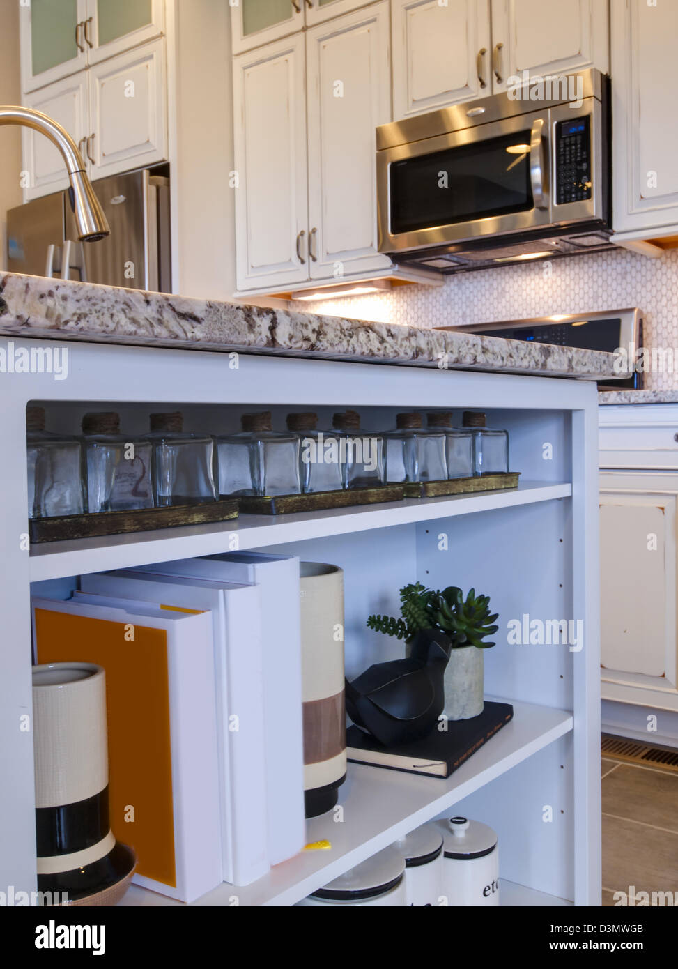 Modern kitchen with white cabinets and stainless appliances Stock Photo ...