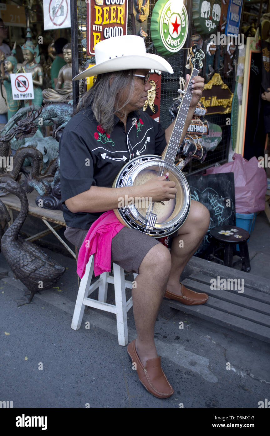 Thai Cowboy Playing Banjo at Chatachuk Market Stock Photo