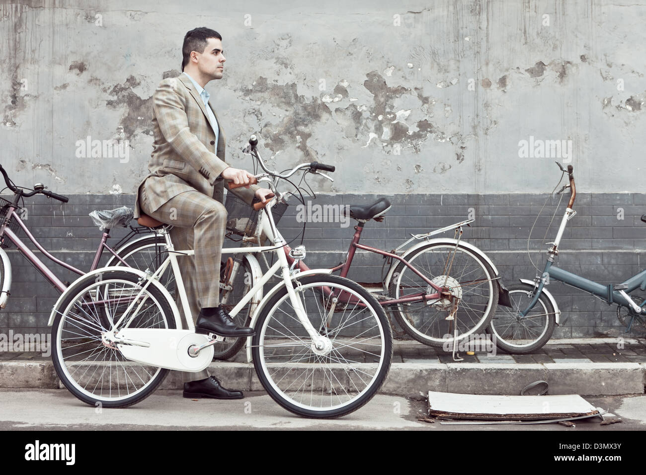 Hispanic Man Riding Bike Hispanic/Latino Man Riding a bicycle in China Stock Photo - Alamy