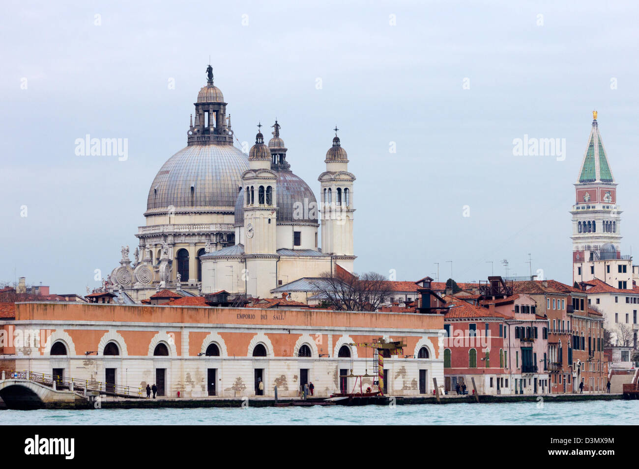 Basilica Santa Maria della Salute and the Campanario bell tower from St Marc's square in the background. Venice, Italy Stock Photo