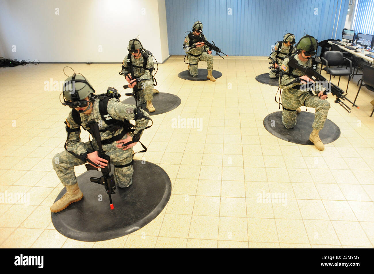 US Army soldiers train using the Dismounted soldier Training System February 21, 2013 at Grafenwoehr, Germany. The DSTS is the first fully-immersive virtual reality training system which simulates a combat environment. Stock Photo