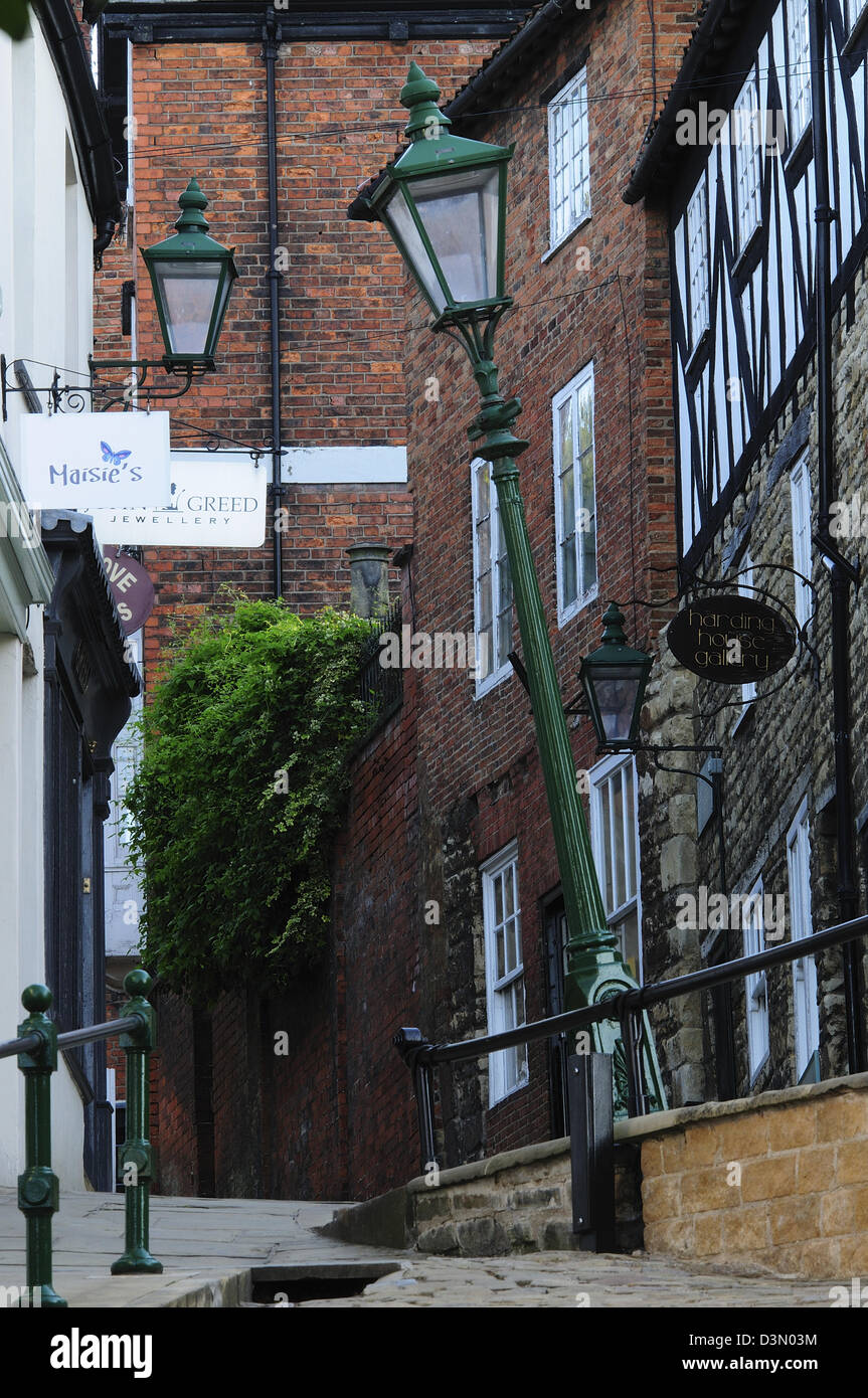 A view of Steep Hill Lincoln Lincolnshire with a leaning lamp-post Stock Photo