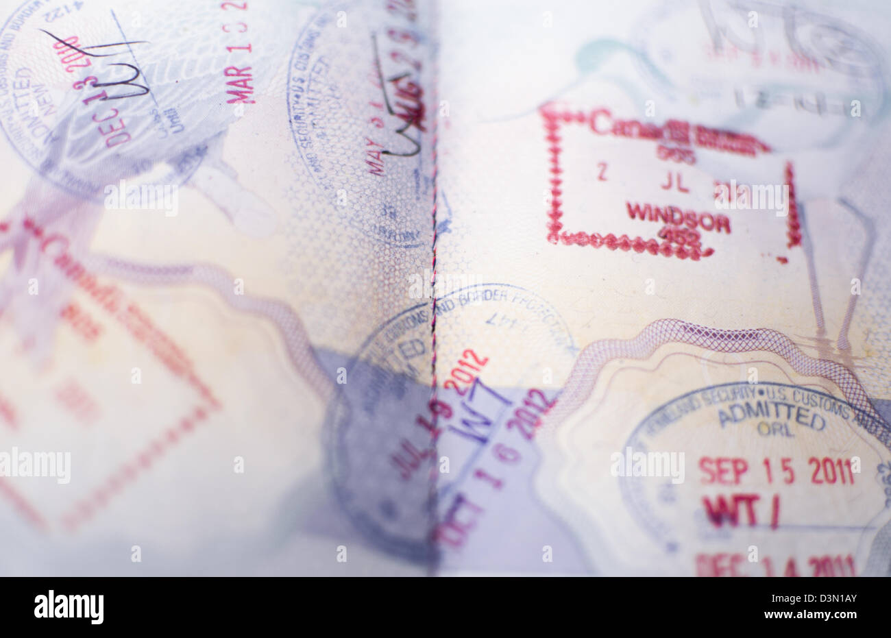 Immigration Canada and US Border Stamps on a British Passport Stock Photo