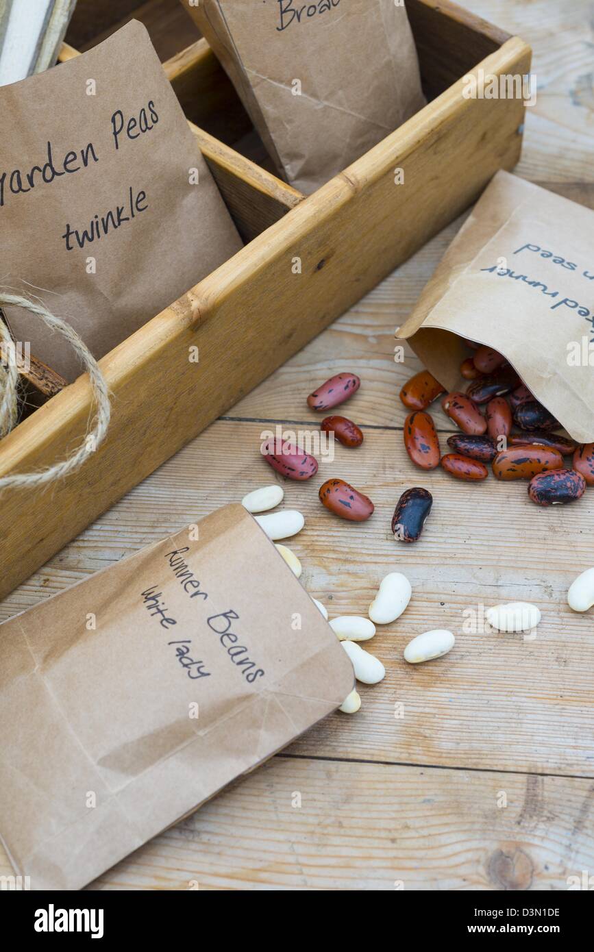 Potting bench springtime still life with saved seeds in homemade packets and gardening items Stock Photo