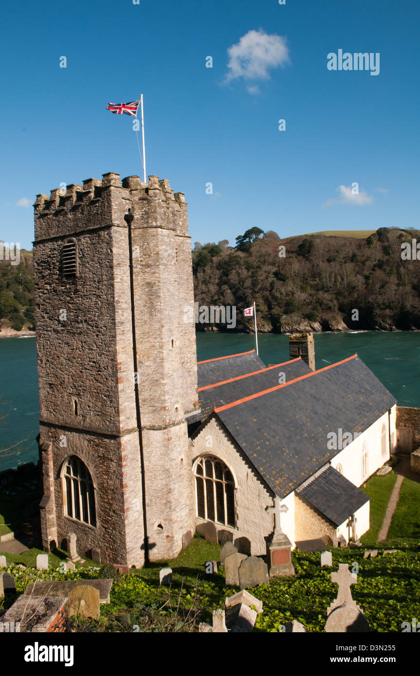 HIstoric St Petrox Church at the mouth of the River Dart near Dartmouth Castle, Devon with a Union Jack flying from the tower Stock Photo