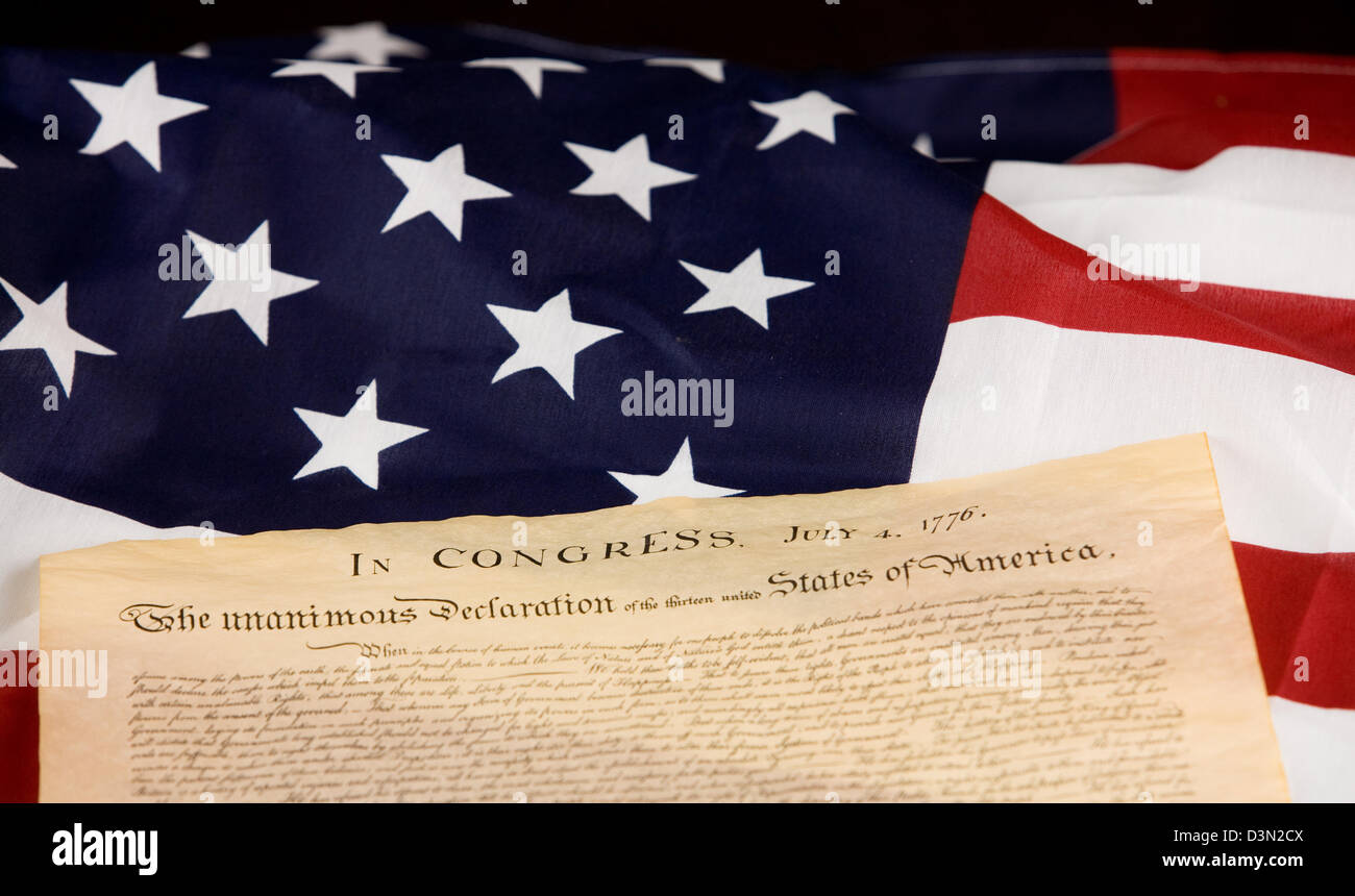 Declaration of Independence against an American flag. Stock Photo