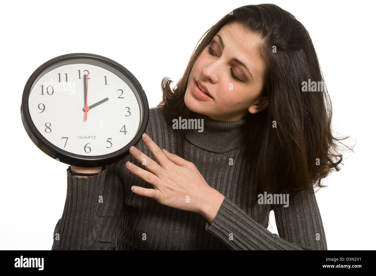 Woman setting clock at daylight savings time Stock Photo Alamy