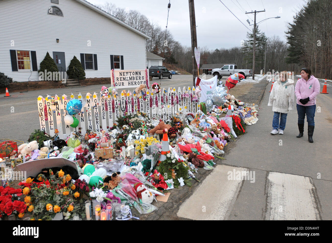 People visit the memorial on the drive to the Sandy Hook Elementary