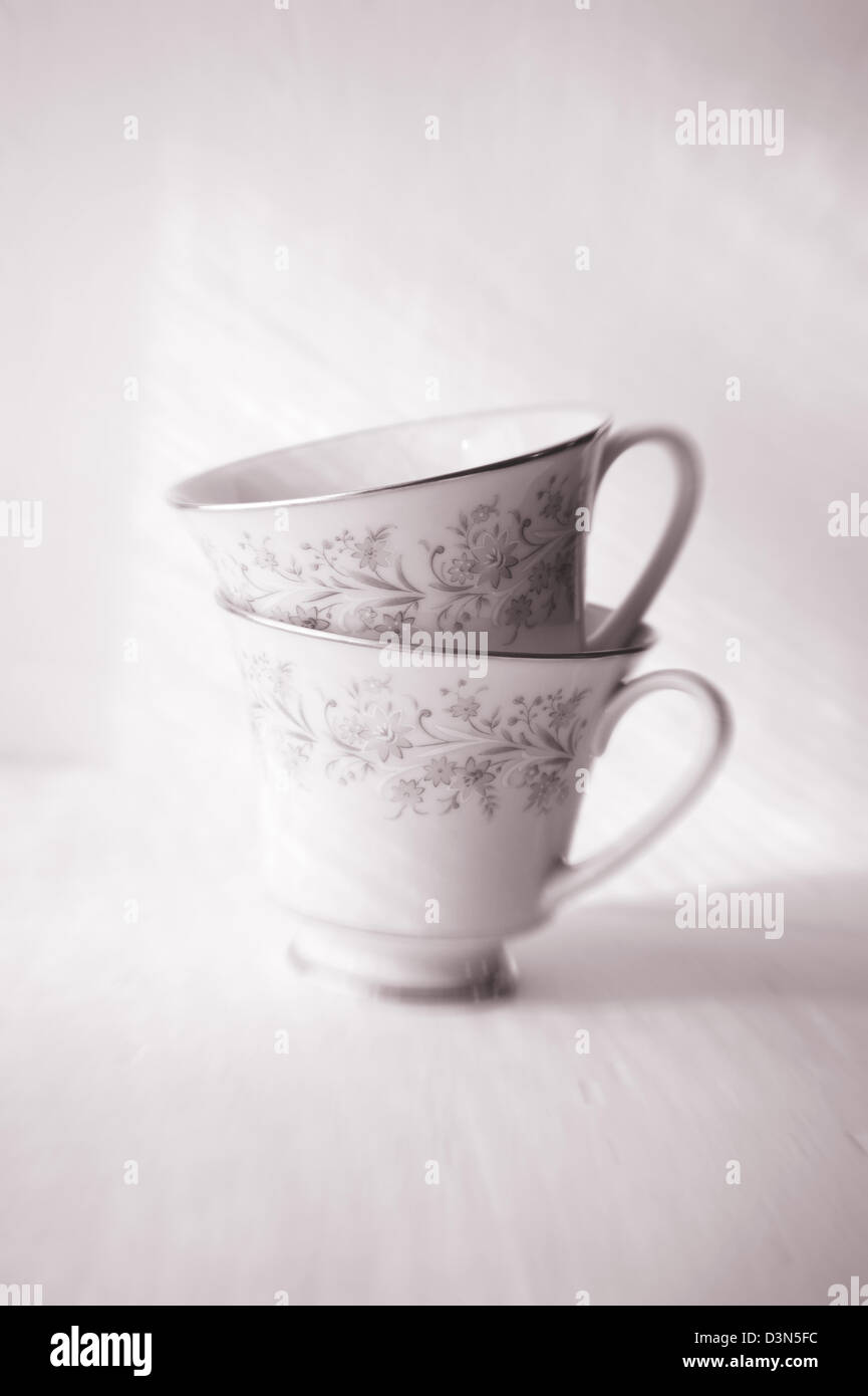Pink and gray duotone  vintage fragile porcelain tea cups Stock Photo