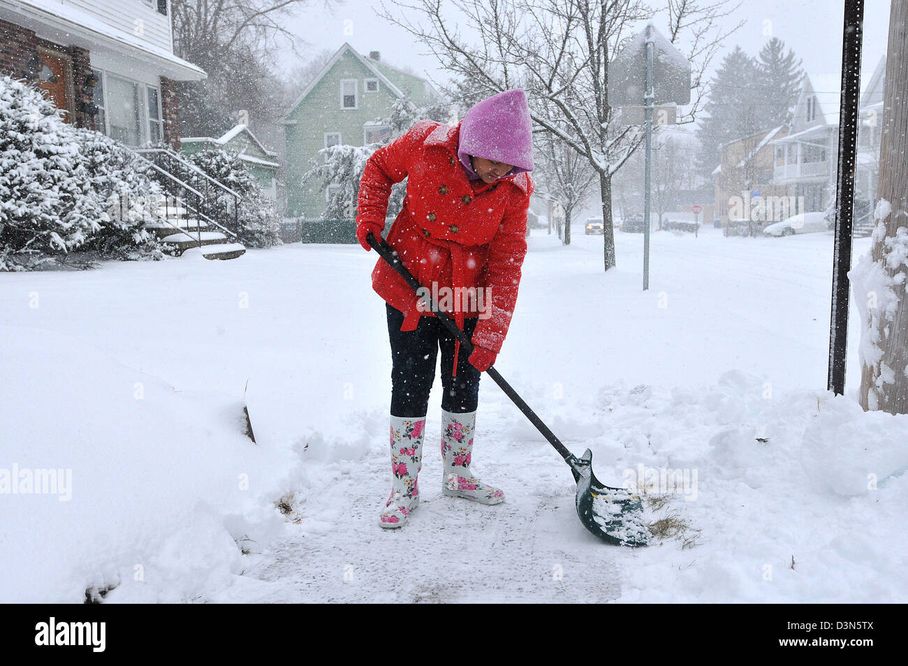 Shoveling snow during storm in CT USA Stock Photo