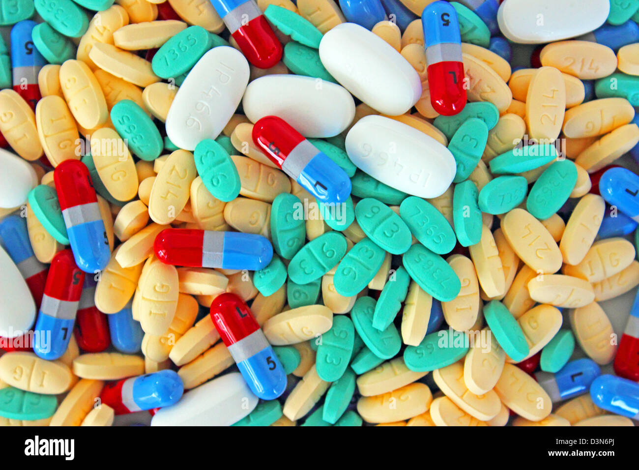 A photograph of a bunch of colorful mixed pills. Can be used as a background. Stock Photo