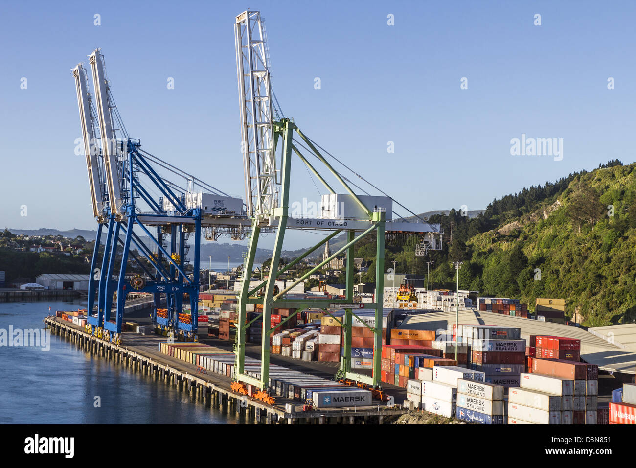 Hoist cranes Shipping Containers stacked at Port Chalmers, Otago Harbour, Dunedin New Zealand Stock Photo