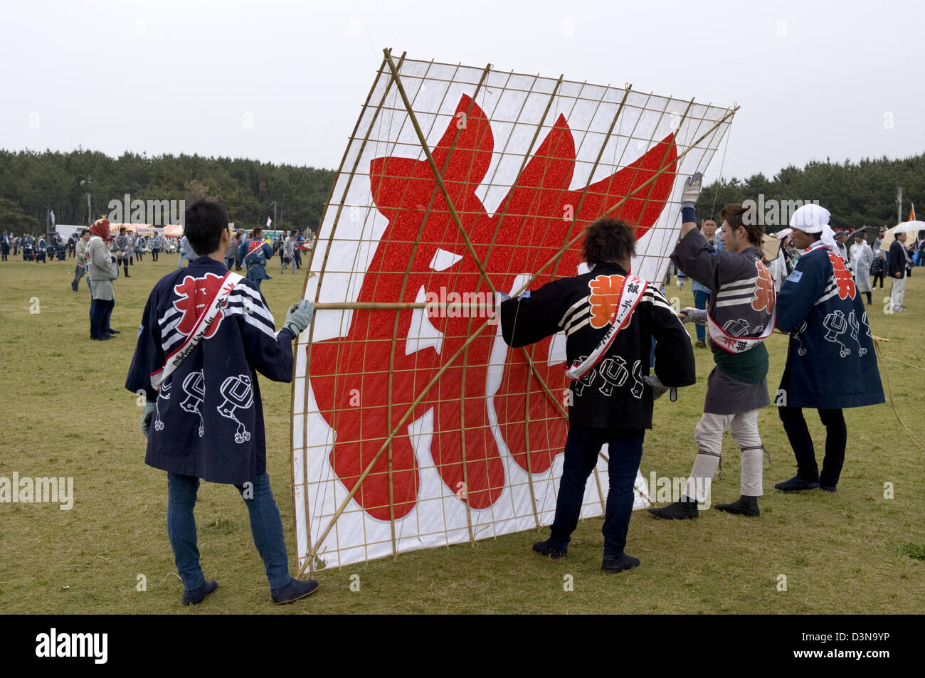 Kite flying team members hold kite prior to launch at Hamamatsu Takoage