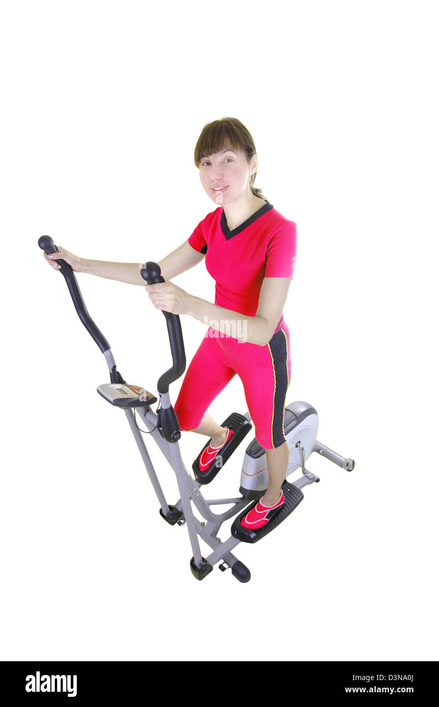 Fit woman on the trainer machine isolated on white Stock Photo