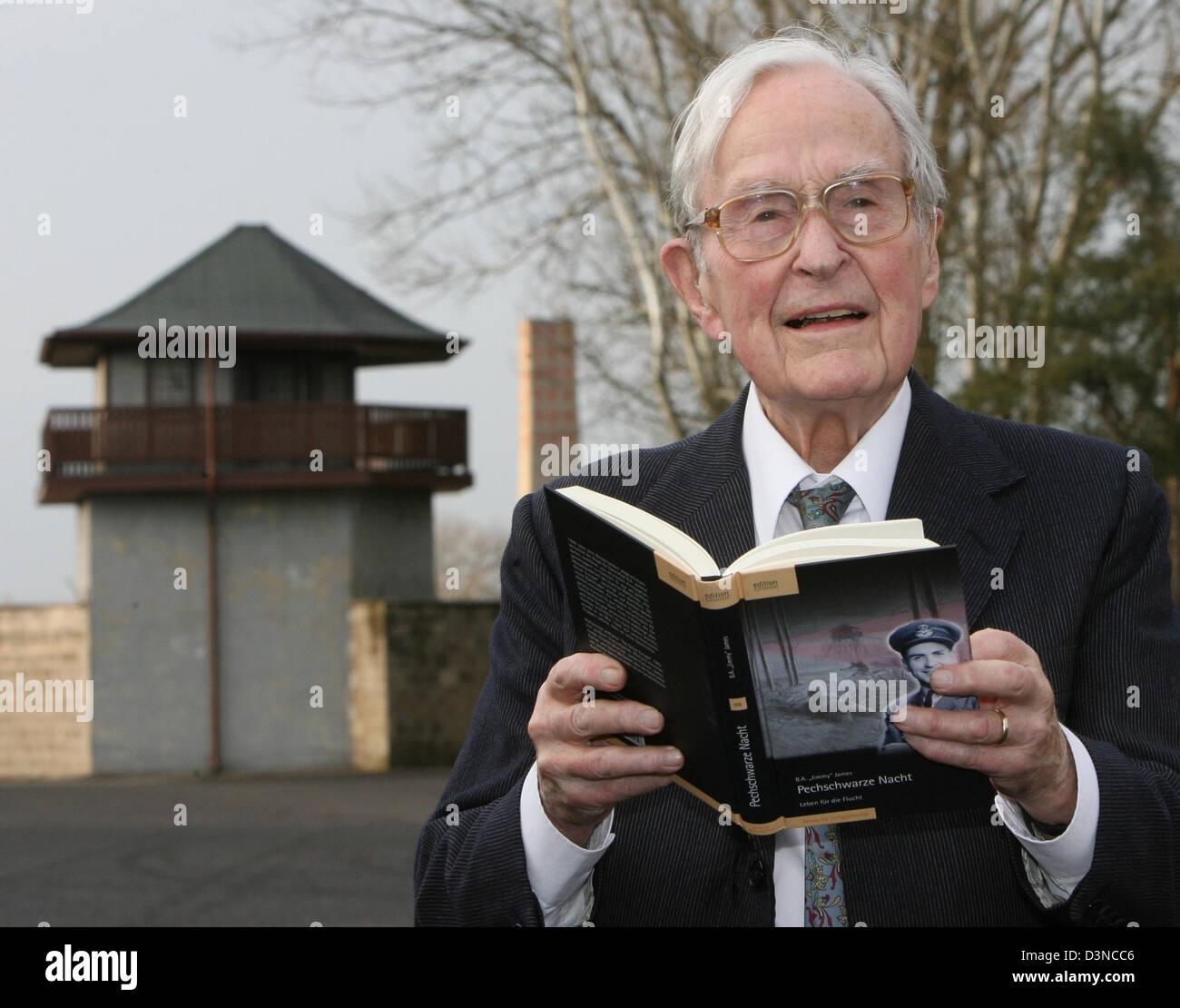 91-year-old former prisoner in the concentration camp Sachsenhausen, Jimmy James, presents his book 'Moonless Night: The Second World War Escape Epic' in the Sachsenhausen memorial place, Germany, Monday, 27 March 2006. The book are his memoirs reporting about his time being pilot of the Royal Air Force and his imprisonment by the Third Reich until end of war. James has been involv Stock Photo