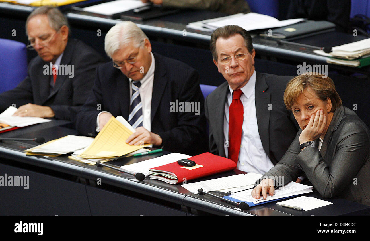 Federal Ministers Wolfgang Schaeuble (Interior), Frank-Walter Steinmeier (Foreign Affairs), Franz Muentefering (Labour and Vice-Chancellor) and Federal Chancellor Angela Merkel (L-R) sit on the government bench in the Bundestag in Berlin, Germany, Tuesday, 28 March 2006. The parliament debates the budget for 2006 in the first reading. Photo: Steffen Kugler Stock Photo
