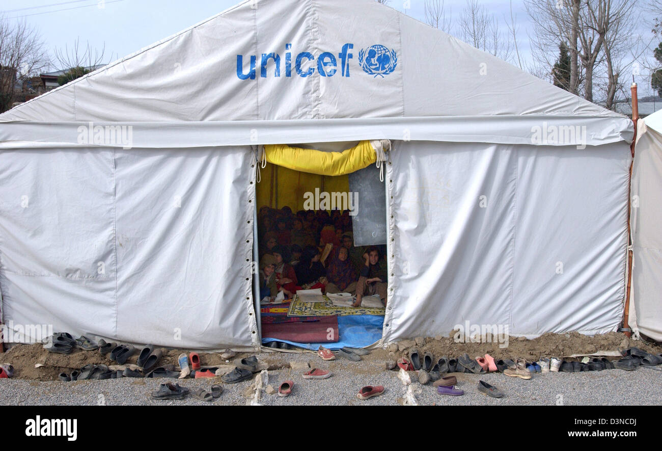 The shoes of children are placed in front of a UNICEF sponsored school tent  in a refugee camp near Balakot, Pakistan, Wednesday, 01 February 2006.  Millions of people suffered in the aftermath