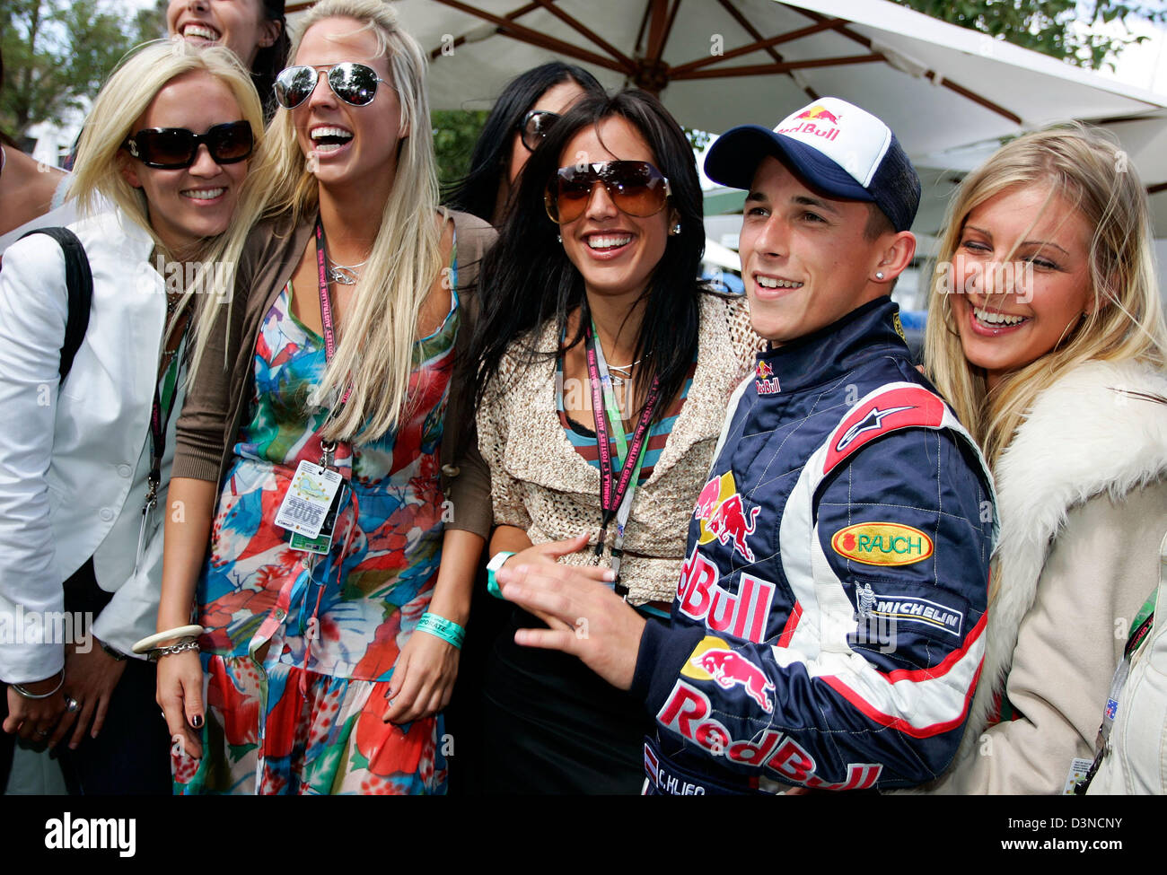 Austrian Formula One driver Christian Klien (2nd R) for Red Bull Racing  team jokes with models in the paddock of the Albert Park Street Circuit in  Melbourne, Australia, Saturday 01 April 2006.