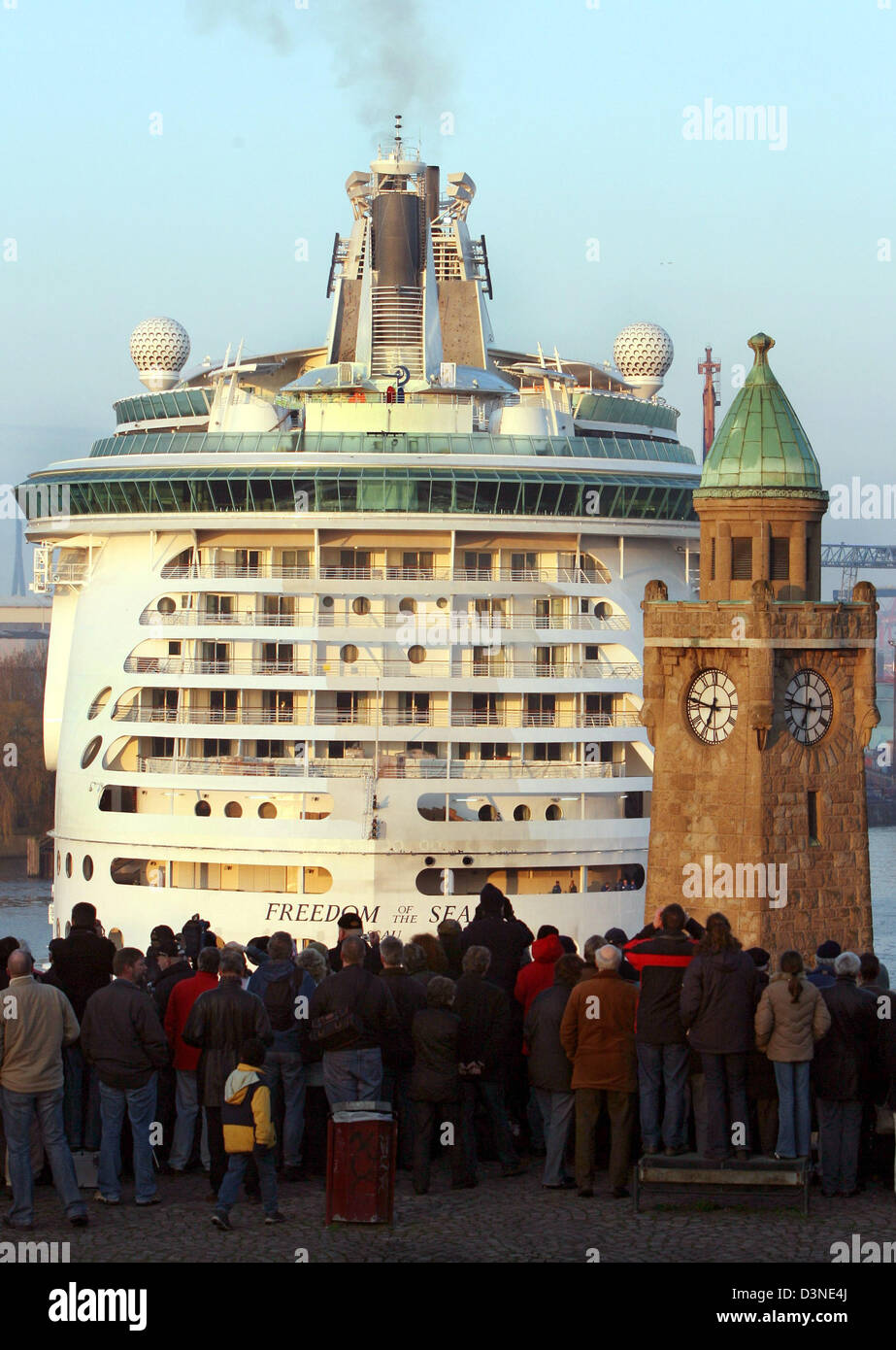 The giant cruiser 'Freedom of the Seas' is watched by many onlookers on