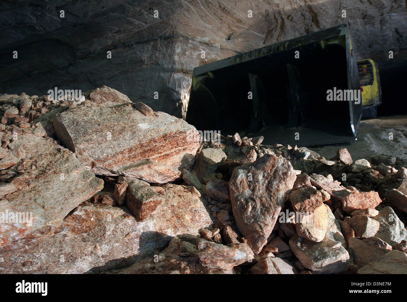 A shovel dozer pictured behind rocks of raw salt in the potash and salt ...