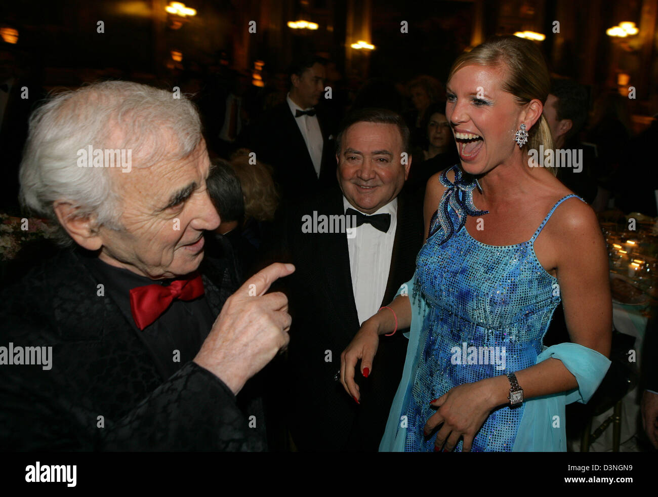 Charles Aznavour (L) and Princess Maja of Hohenzollern photograhed laughing at the event 'Soiree de Gala au Chateau de Versailles', Versailles, France, Monday 30.01.2006. The proceeds of the gala will be donated to the French cancer foundation AVEC. The event featured a performance by Charles Aznavour in the opera and a festive meal in the Galerie des Batailles of Castle Versailles Stock Photo