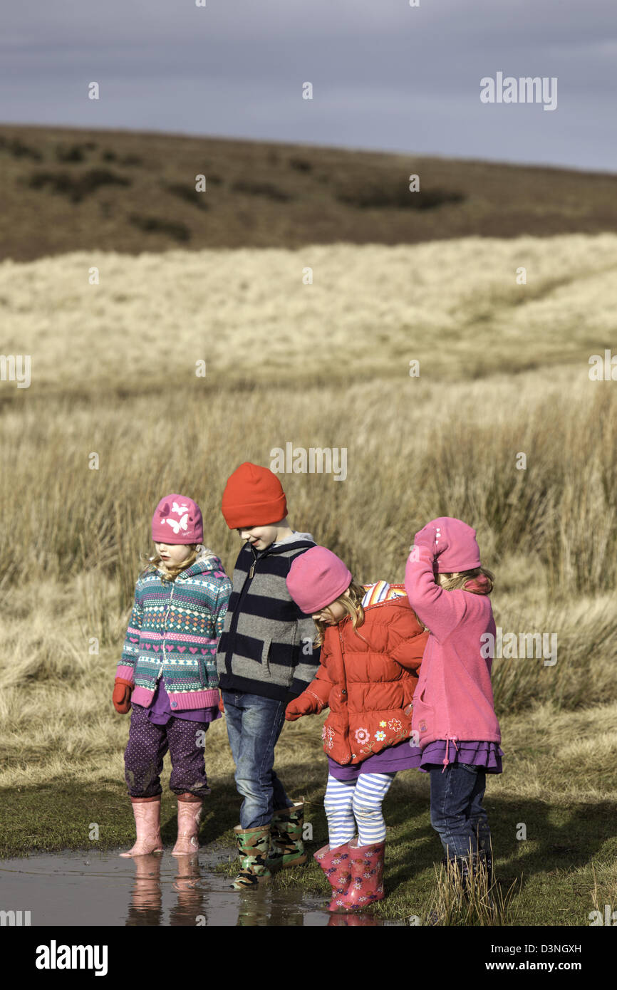 Children playing near Mitchell's Fold Stone Circle, Stapeley Hill Shropshire, England, UK Stock Photo