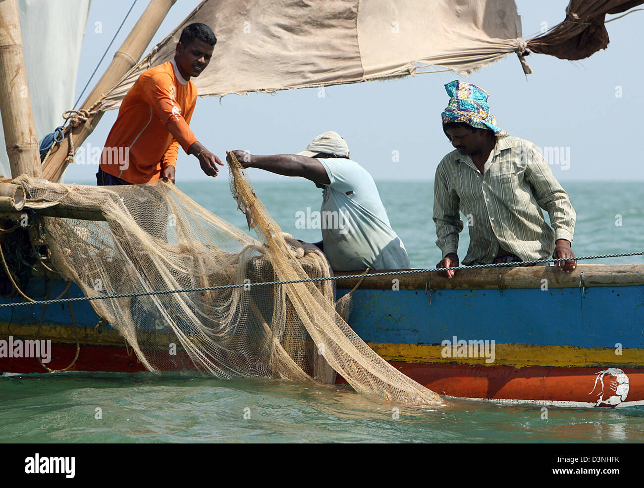 Fishermen trawl shrimp offshore Negombo, Sri Lanka, 05 May 2006. Most ...