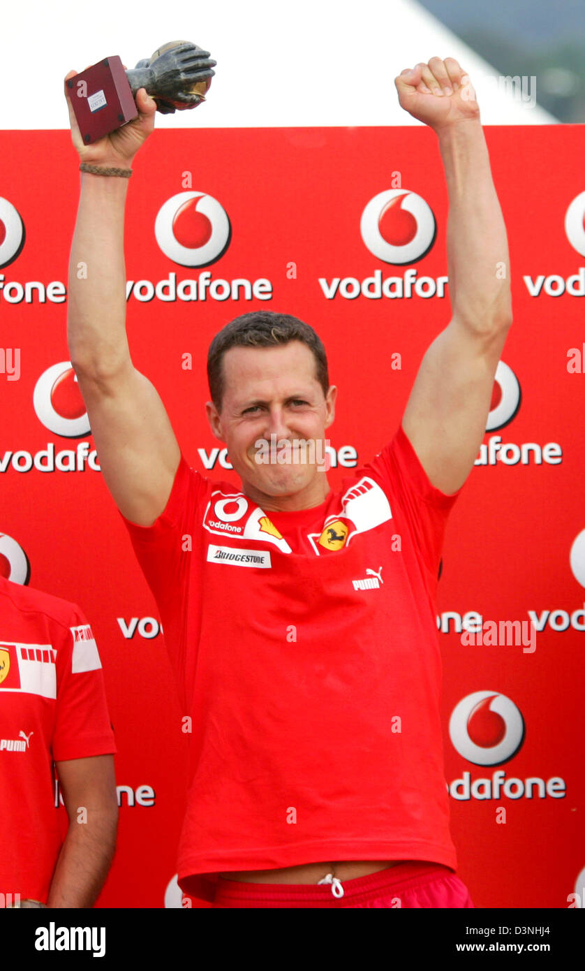 German Formula One driver Michael Schumacher of Scuderia Ferrari F1 team lifts his trophy after his victory during a beach soccer match at the F1 race track Circuit de Catalunya in Montmelo near Barcelona, Spain, Thursday 11 May 2006. The Grand Prix of Spain takes place on Sunday. Photo: Gero Breloer Stock Photo