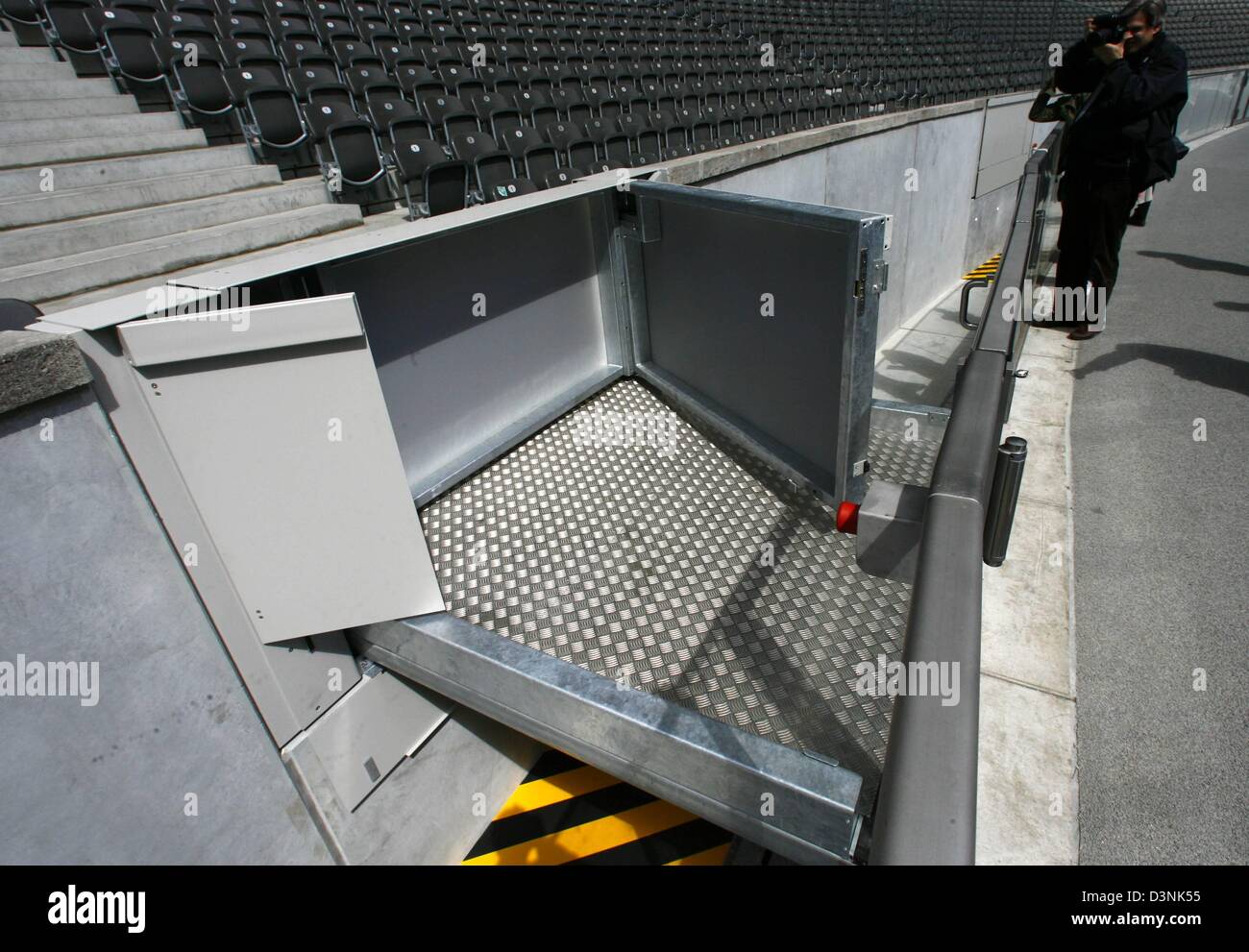 A journalist takes a picture of one of the ramps in the Olympic stadium ...