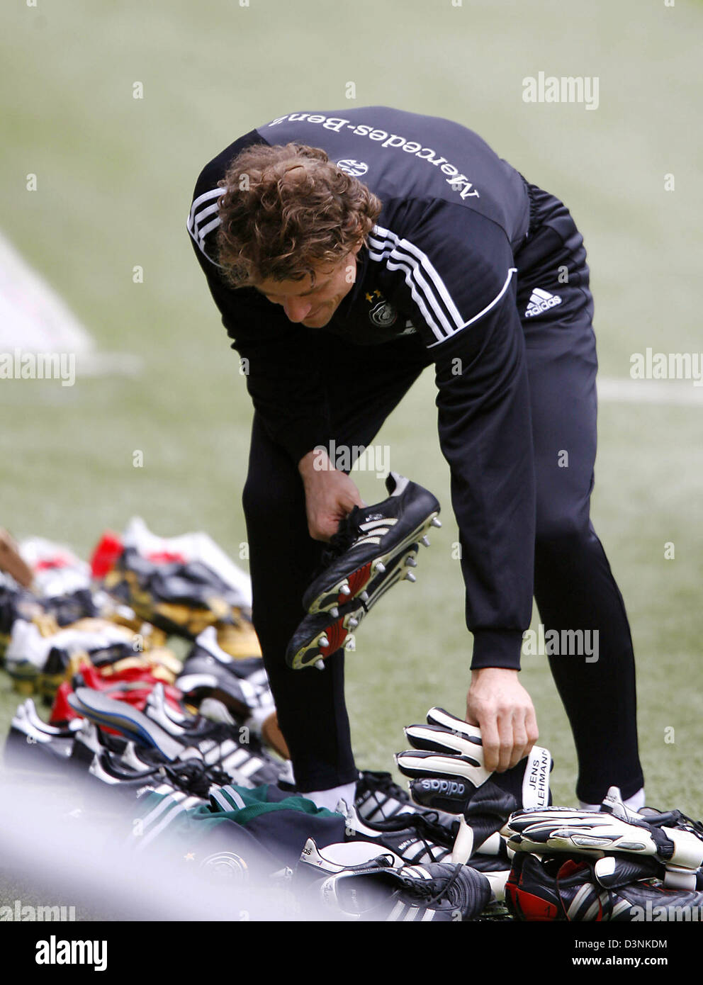 German international goalie Jens Lehmann picks the right shoes during the  training in Geneva, Switzerland, 29 May 2006. The German national soccer  team is preparing for the FIFA World Cup 2006 with