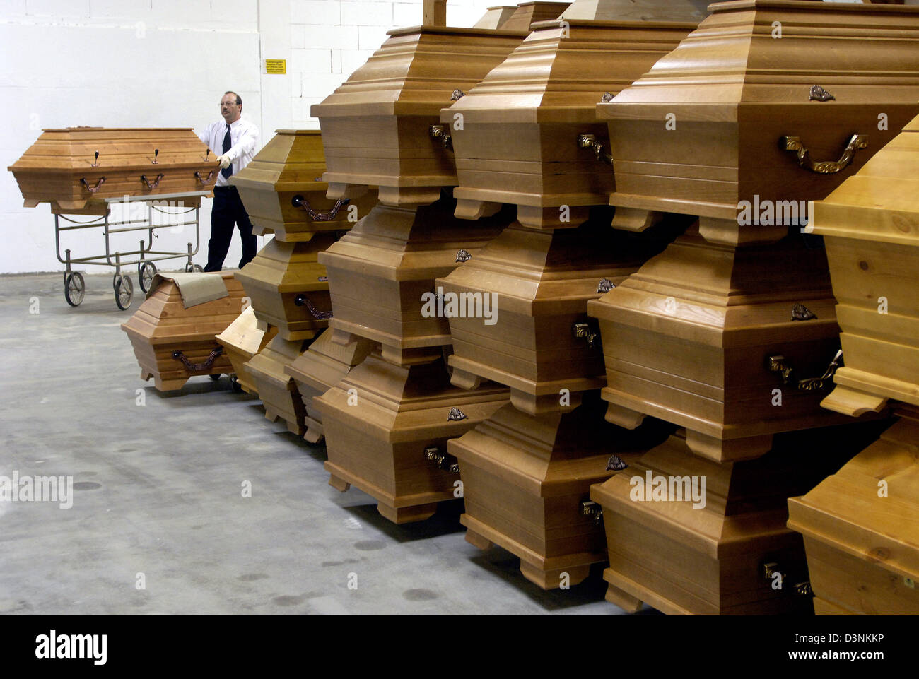 An employee of the funeral undertaker Karl Schumacher stands in a store