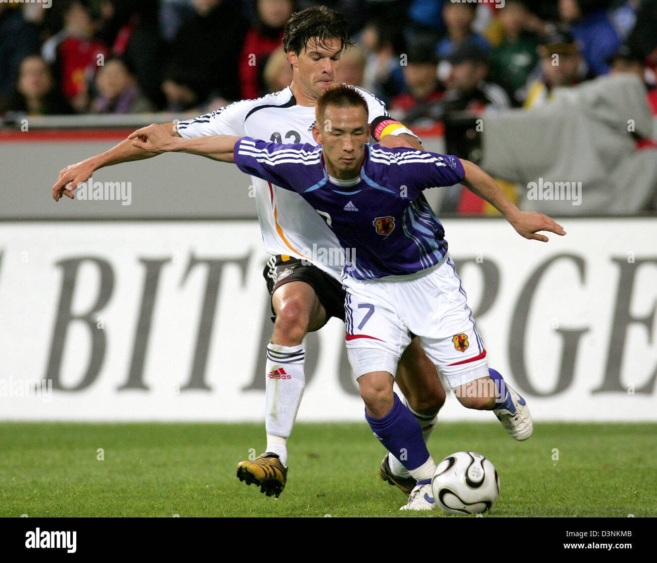 German national soccer player Michael Ballack (L) fights with Japan's ...