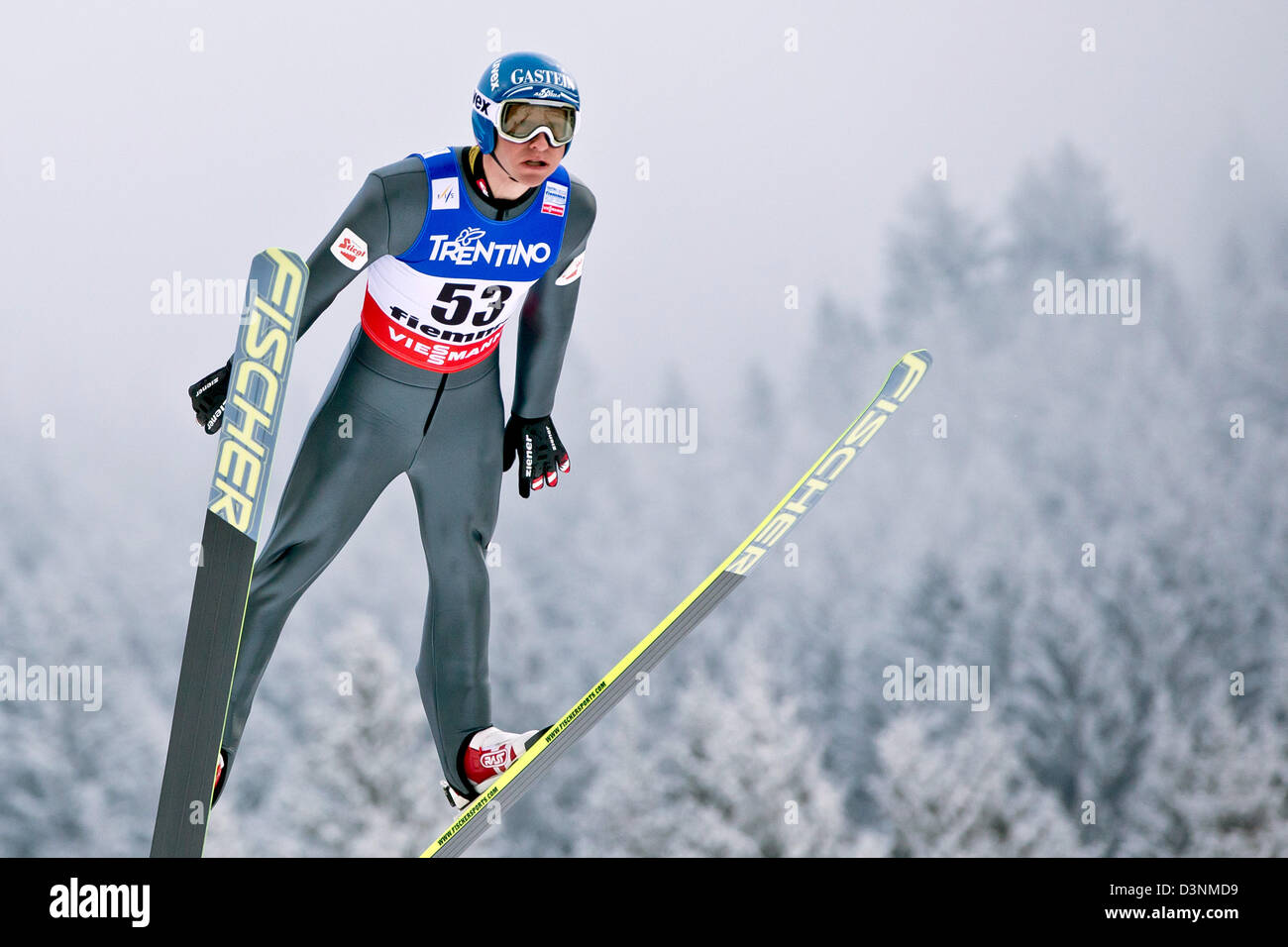 Bernhard Gruber of Austria soars through the air during his trial jump ...