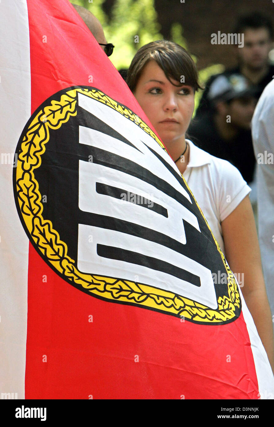 A neo-Nazi pictured with her flag in Gelsenkirchen, Germany, Saturday, 10 June 2006. The rally of circa 200 rightist-extremist party NPD supporters was permitted by the Federal Constitutional Court only Friday, 9 June after the higher administrative court Muenster had prohibited it. The judges in Muenster reasoned their decision with a massive breach of the public security. Photo:  Stock Photo