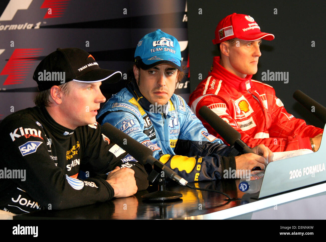 Formula One pilots (L-R) Finnish Kimi Raikkonen of McLaren Mercedes,  Spanish Fernando Alonso of Renault and German Michael Schumacher of Ferrari  at the press conference after the Qualifying session to tomorrow's 2006