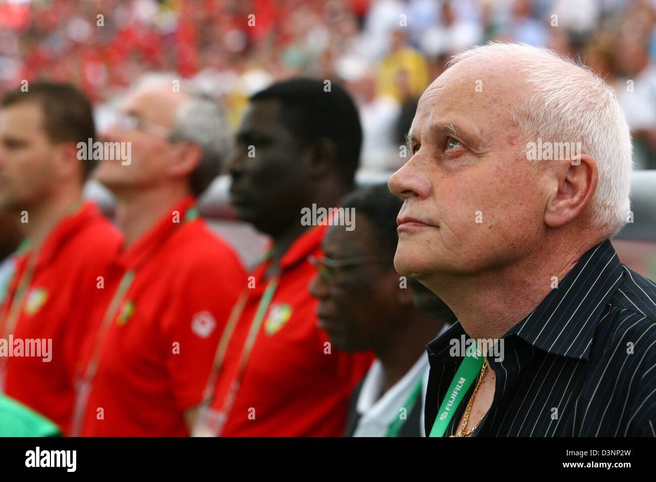 Togo national coach German Otto Pfister (R) stands in front of the bench prior to the 2006 FIFA World Cup group G match of Korea Republic vs Togo in Frankfurt, Germany, Tuesday, 13 June 2006. DPA/FELIX HEYDER +++ Mobile Services OUT +++ Please also refer to FIFA's Terms and Conditions. +++(c) dpa - Bildfunk+++ Stock Photo