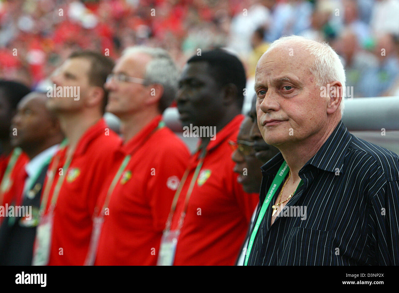Togo national coach German Otto Pfister (R) stands in front of the bench prior to the 2006 FIFA World Cup group G match of Korea Republic vs Togo in Frankfurt, Germany, Tuesday, 13 June 2006. DPA/FELIX HEYDER +++ Mobile Services OUT +++ Please also refer to FIFA's Terms and Conditions. +++(c) dpa - Bildfunk+++ Stock Photo