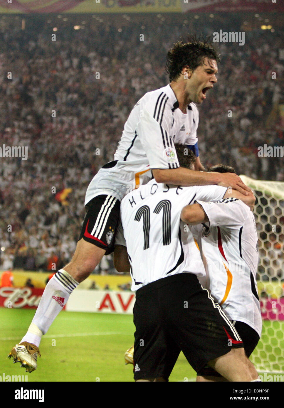 German national soccer player Oliver Neuville (hidden) celebrates his 1