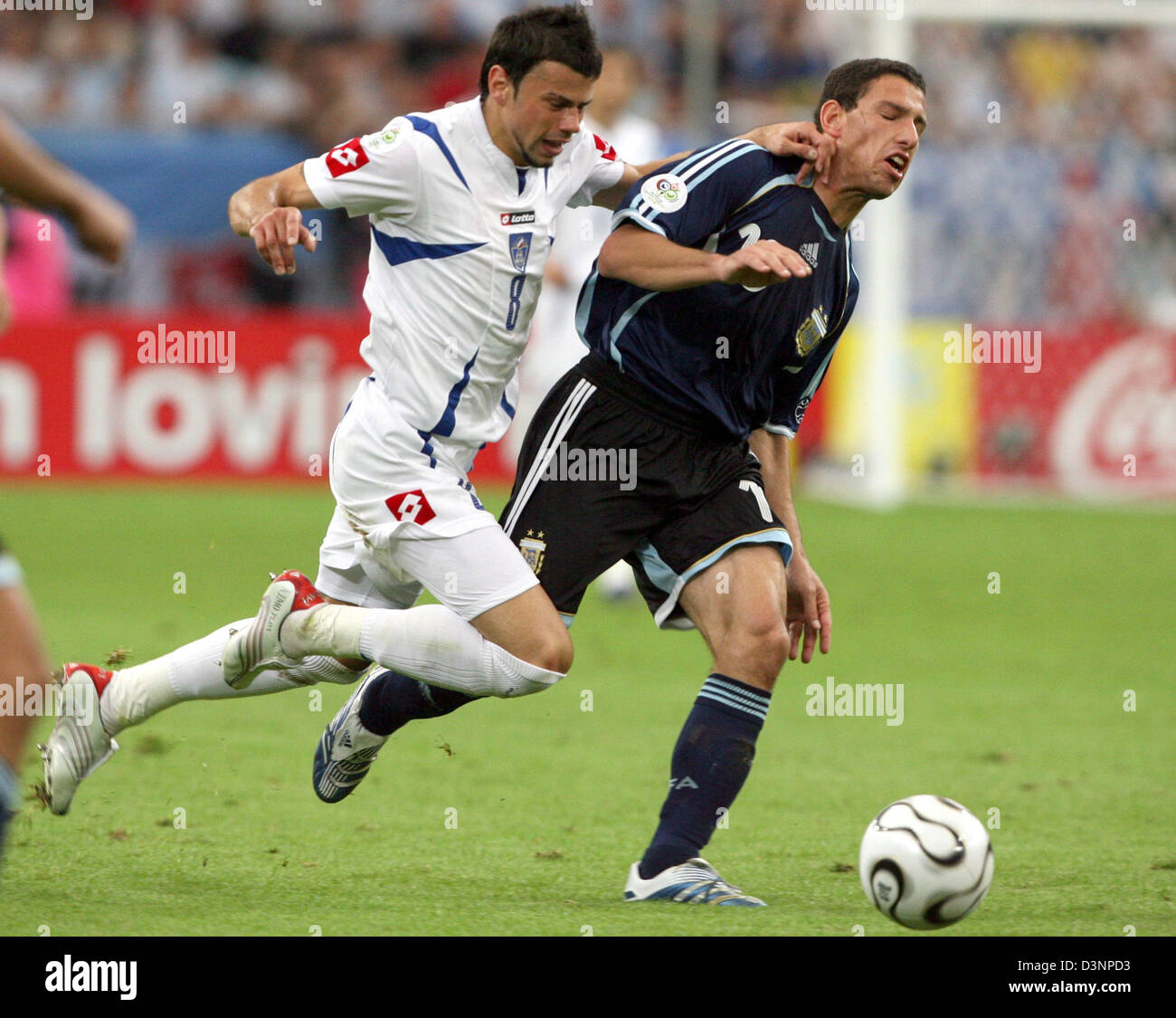 Argentinian player Juan Riquelme (R) is under pressure by Mateja Kezman from Serbia-Montenegro during the 2006 FIFA World Cup group C match of Argentina vs Serbia and Montenegro in Gelsenkirchen, Germany, Friday, 16 June 2006. DPA/ROLAND WEIHRAUCH +++ Mobile Services OUT +++ Please refer to FIFA's Terms and Conditions. +++(c) dpa - Bildfunk+++ Stock Photo