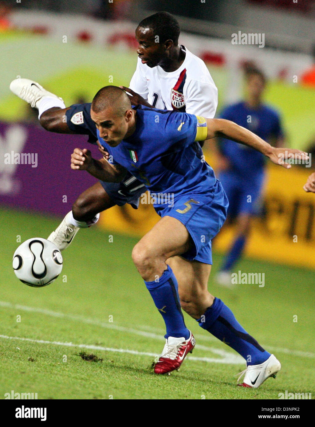 US player DaMarcus Beasley (up) and ItalyÂs Fabio Cannavaro fight for the ball during the group E match of the 2006 FIFA World Cup between Italy and the USA in Kaiserslautern, Germany, Saturday 17 June 2006. EPA/OLIVIER MATTHYS +++ Mobile Services OUT +++ Please also refer to FIFA's Terms and Conditions. Stock Photo