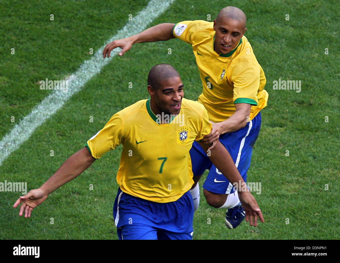 Brazilian Adriano (L) celebrates with his team-mate Roberto Carlos (R)  after scoring his team's first goal against Australia during the group F  match of the 2006 FIFA World Cup between Brazil and