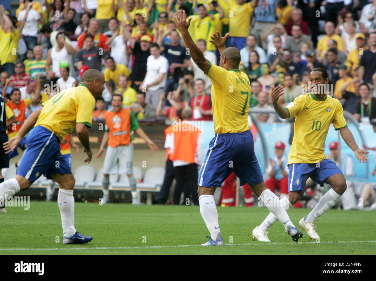 (L-R) Ronaldo, goalscorer Adriano and Ronaldinho celebrate the 1:0 score during the group F match of the 2006 FIFA World Cup between Brazil and Australia in Munich, Germany, Sunday, 18 June 2006. DPA/ALEXANDER RUESCHE +++ Mobile Services OUT +++ Please refer to FIFA's terms and conditions Stock Photo