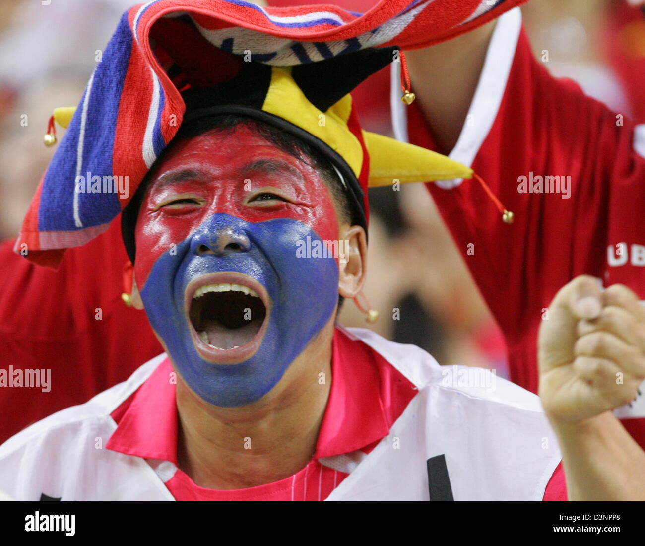 A fan of the South Korean national soccer team cheers during the FIFA