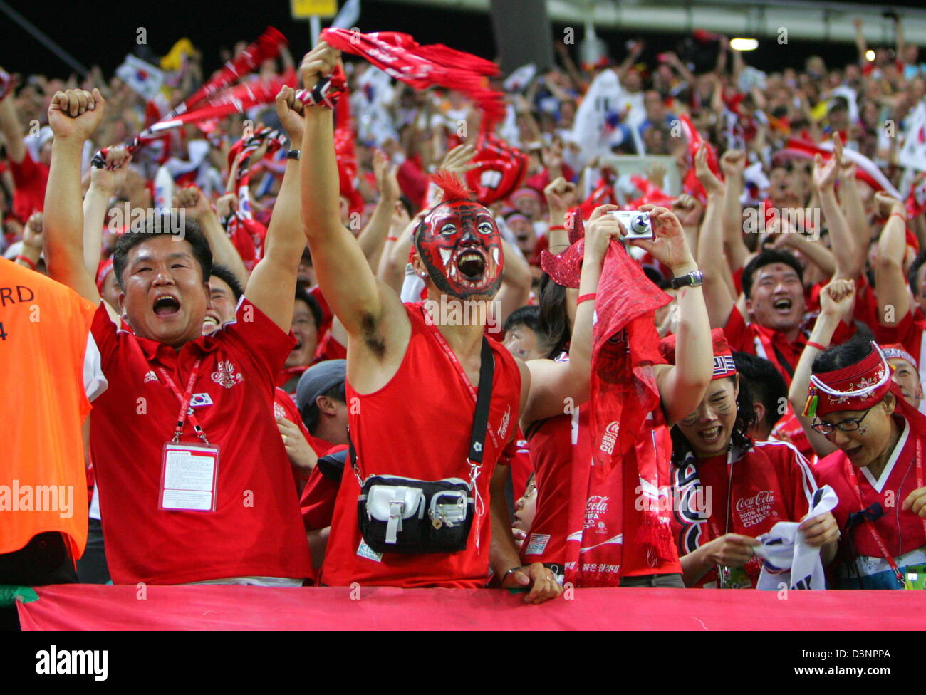 Fans of the South Korean national soccer team cheer during the FIFA