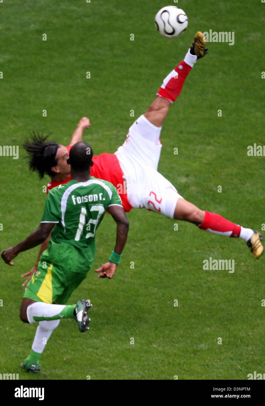 Richmond Forson (L) from Togo watches the bycicle kick of Hakan Yakin