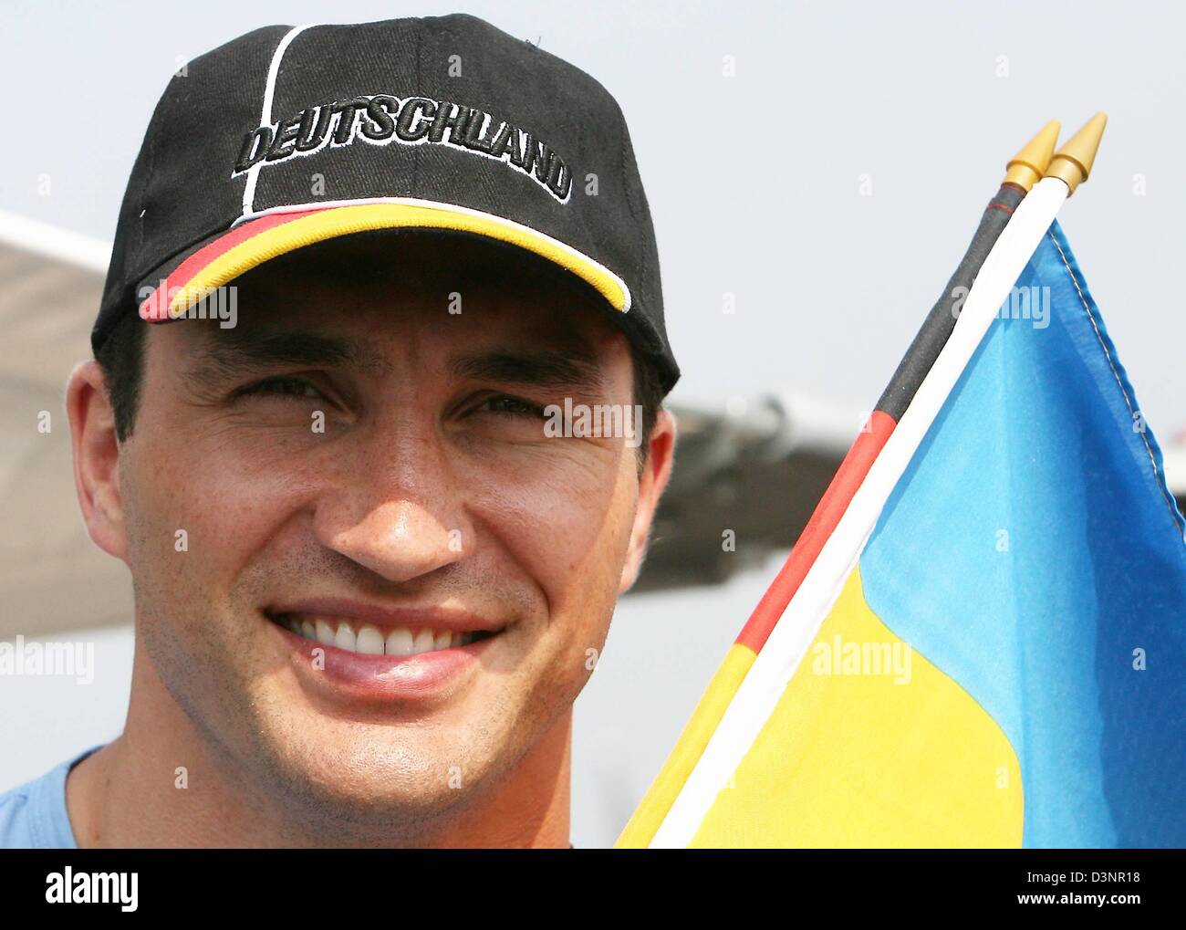 Boxer Wladimir Klitschko shown holding a Ukraine flag and wearing a