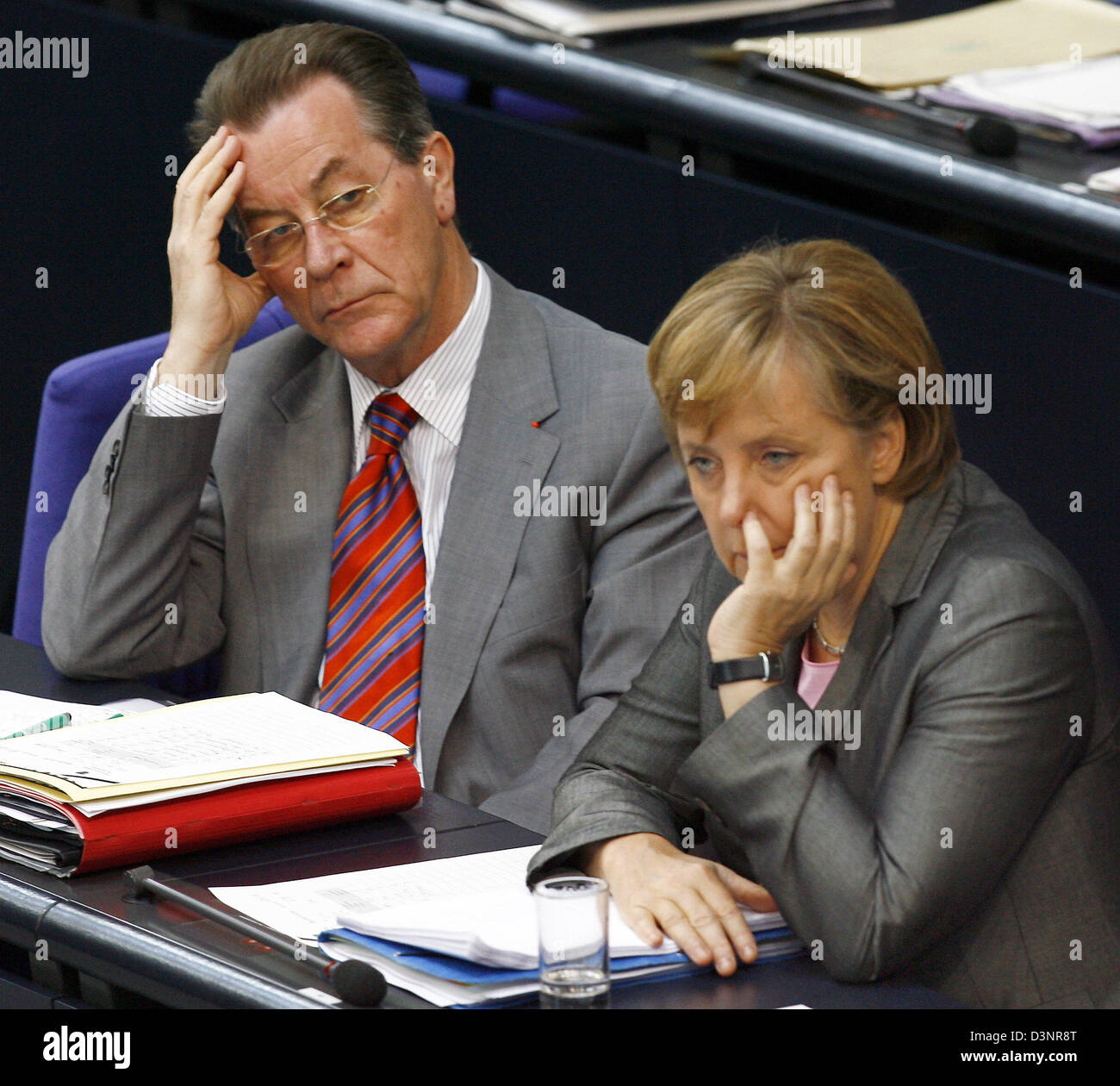 German Chancellor Angela Merkel (R) sits beside Federal Minister for Labour and Social Affairs Franz Muentefering during a German Bundestag budget debate in Berlin, Germany, Thursday, 22 June 2006. Photo: Steffen Kugler Stock Photo