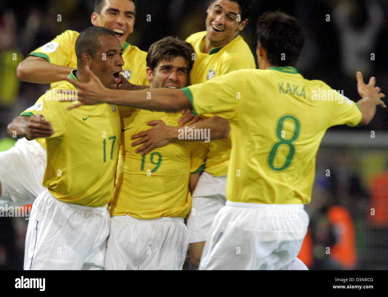 Juninho Pernambucano (C) from Brazil is celebrated by teammates Gilberto Silva (L-R) Lucio, Cicinho and Kaka after scoring the 2-1 lead against Japan during the group F match of 2006 FIFA World Cup between Japan and Brazil in Dortmund, Germany, Thursday 22 June 2006. DPA/BERND THISSEN +++ Mobile Services OUT +++ Please refer to FIFA's Terms and Conditions. Stock Photo